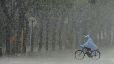 半岛电视台-中国暴雨已致4人死亡11省发布洪水预警